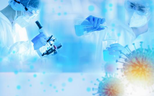 Rearchers working in a lab with abstract covid-19 virus surrounding them. 