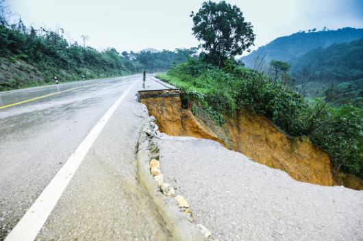 A road where parts of it has disappeared in a landslide.