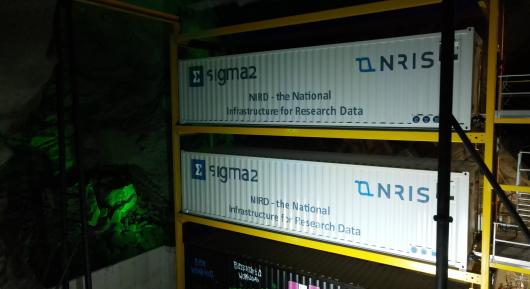 Two large containers in a yellow rack.